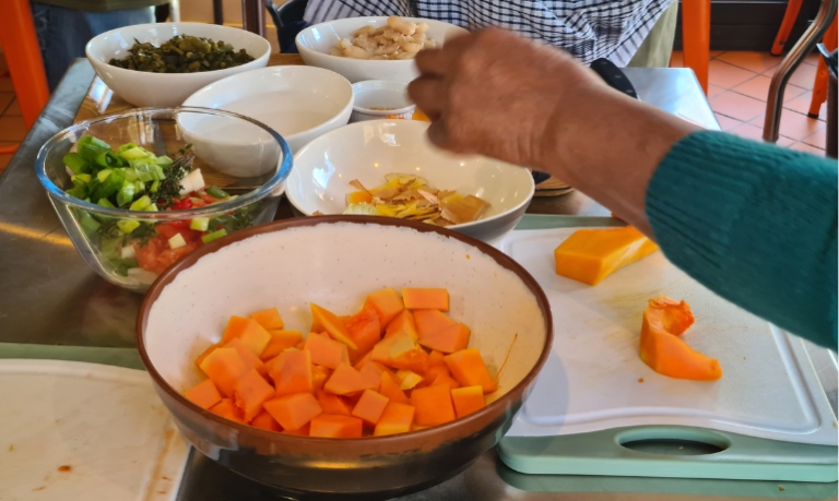 Preparing food at a Hackney Giving funded project about healthy living